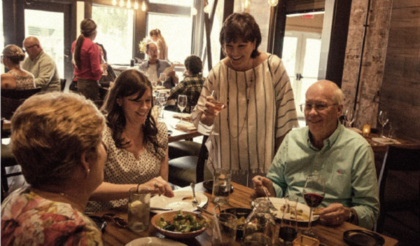 Bridges-Craft-Pizza-and-Wine-Bar-Indiana--People-having-fun-with-host-enjoy-food-and-wine